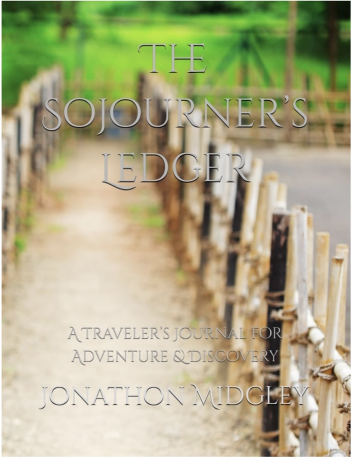 Book cover for ‘The Sojourner’s Ledger’ by Jonathon Midgley. A soft-focused dirt path lined with rustic wooden fences leads into a green, tree-filled background. Print-only travel journal for documenting adventures and discoveries.